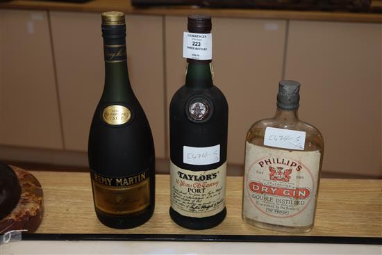 A bottle of Remy Martin, a bottle of Tawny port and a bottle of gin